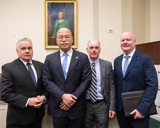 Rep. Smith stands with witnesses after the Congressional-Executive Commission on China's (CECC) September 16th hearing, entitled 